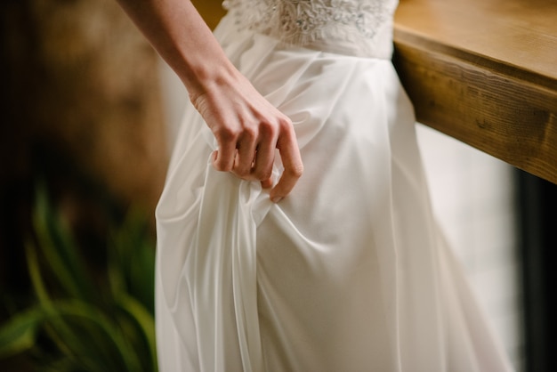 Hand on a white dress