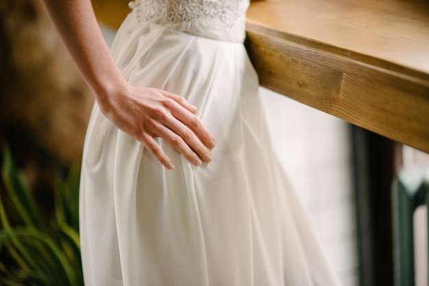 Hand on a white dress