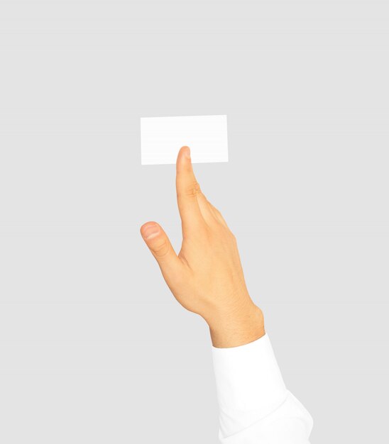 Hand in white sleeve shirt holding blank business card 