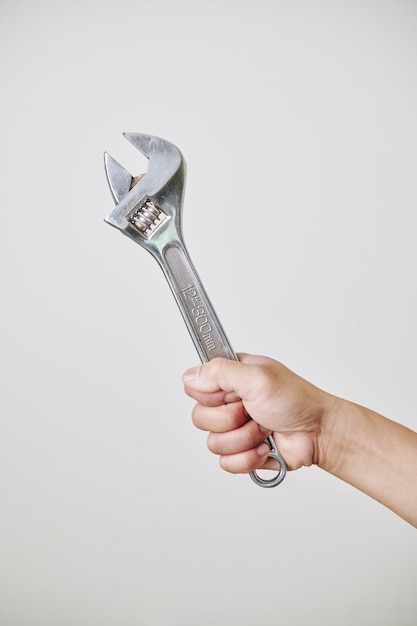 Hand with adustable wrench