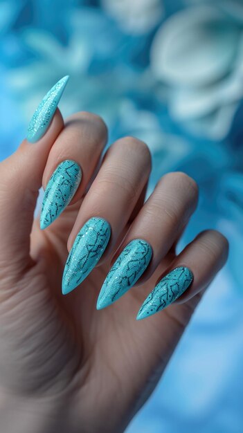 A hand with a blue manicure holding a blue flower