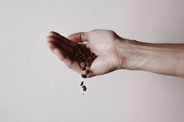 hand with coffee beans