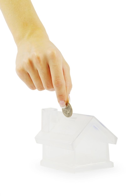 Hand with coin and house