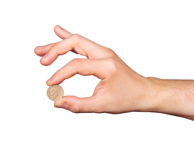 Hand with coin isolated on white background.