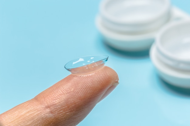 Hand with contact lens