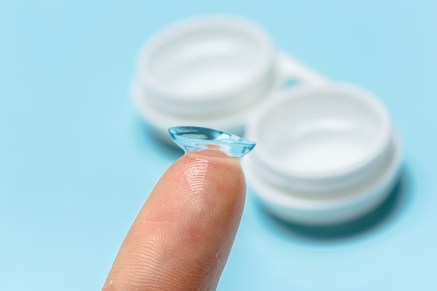 Hand with contact lens