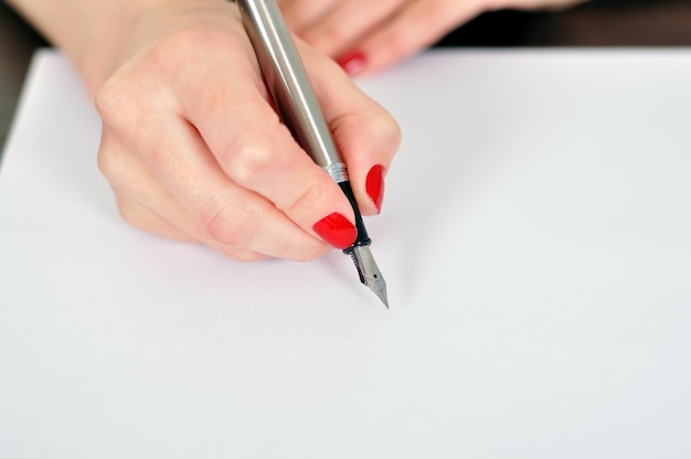 Hand with fountain pen