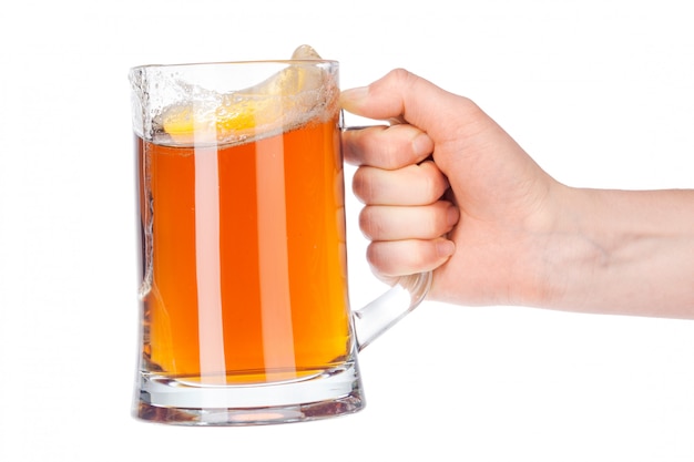 Hand with full beer glass isolated on white 