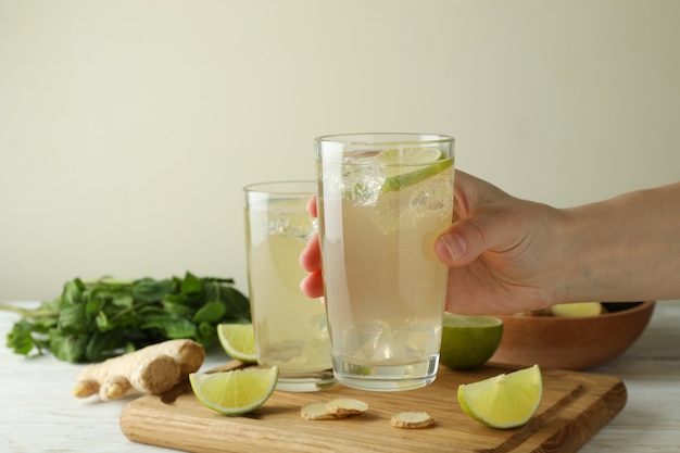 hand with glass of ginger beer