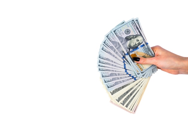 Hand with money isolated on white background. US Dollars in hand. Handful of money.