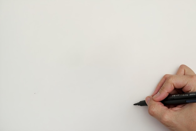 Hand with pen marker will write on white blank background