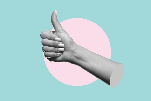 A hand with a pink circle and the word thumbs up on it