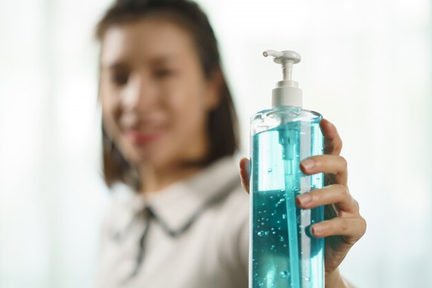 Hand with sanitizer gel against virus