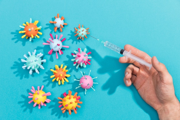 Hand with syringe for bacteria