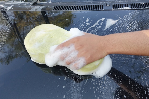 hand with wash car          