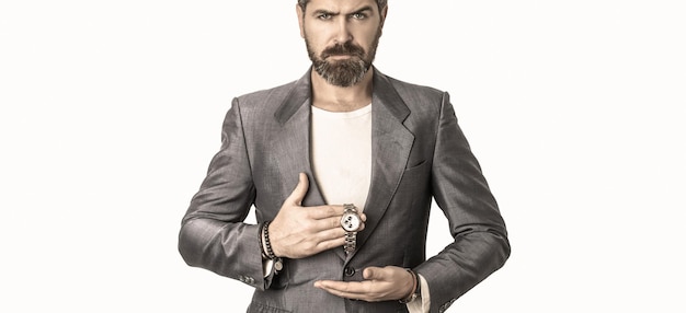 Hand in with wrist watch in a business suit. Elegant handsome man in suit. Sexy male, brutal macho, hipster. Businessman checking time from watch. Business man showing time on his wrist watch