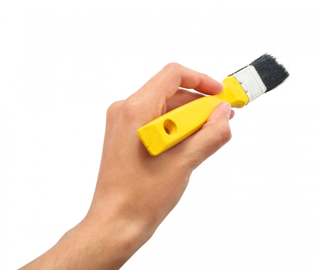 Hand with yellow brush