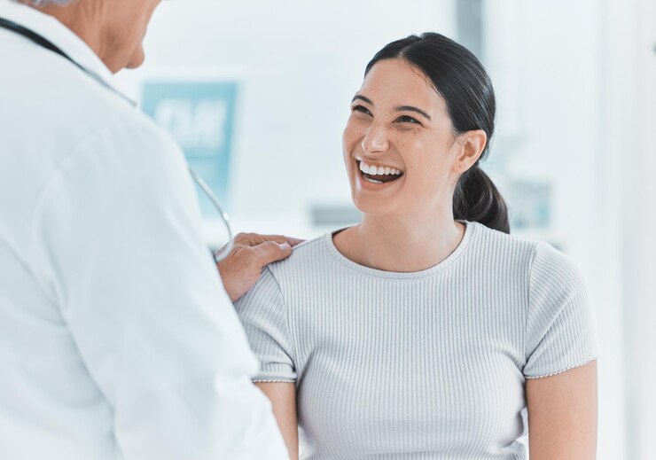 Photo hand woman and doctor in hospital healthcare and greeting of patient smile and gynecologist office talking and diagnosis in clinic treatment and advice for contraception and obstetrician