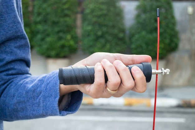 Hand of woman holding a speed jump rope