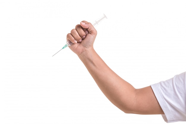 Hand of woman holding syringe.