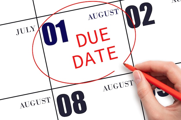Hand writing text DUE DATE on calendar date August 1 and circling it Payment due date