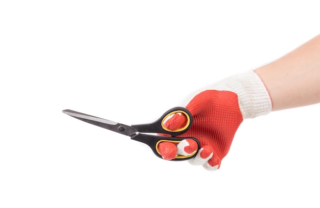 Photo hand in yellow glove holding scissors