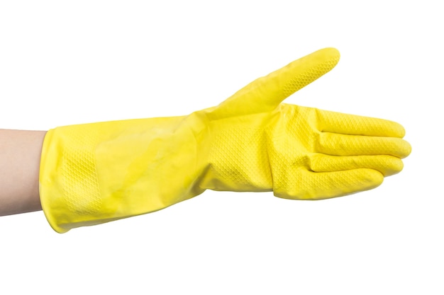 白い背景の写真で隔離、キッチンの掃除のための黄色のゴム手袋を手に