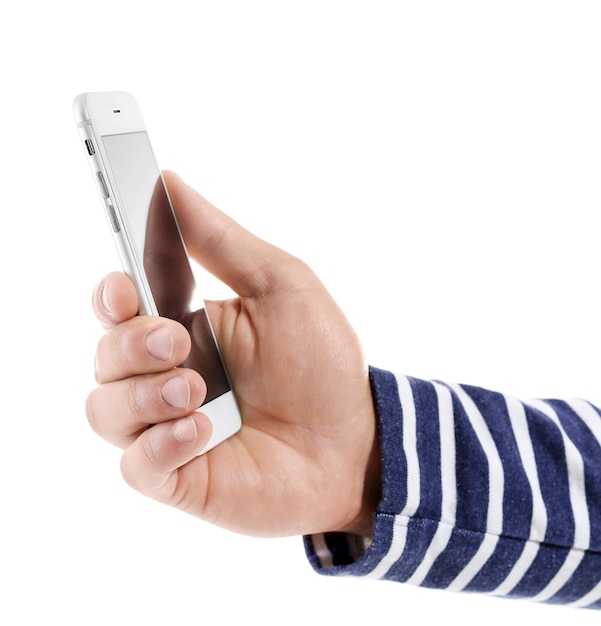 Hand of young man with mobile phone on white background