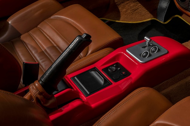 Handbrake of a luxury sports car finished in red and\
leather