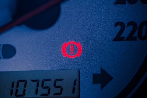 Handbrake warning light sign illuminated close up