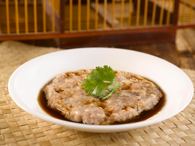 HandChopped Minced Pork with Water Chestnut served in a dish isolated on table side view