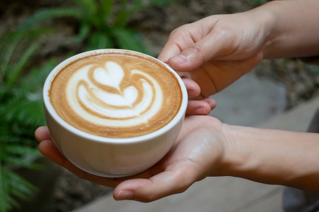 Handcraft of hot milk coffee cup, stock photo