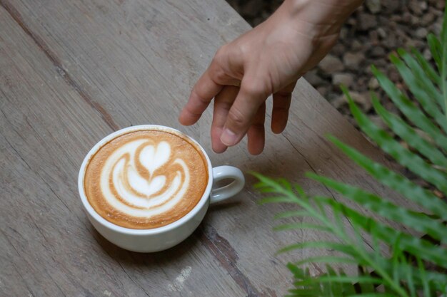 Handcraft of hot milk coffee cup, stock photo