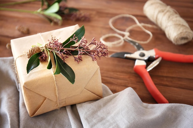 Handcrafted gift box with flowers on wooden table