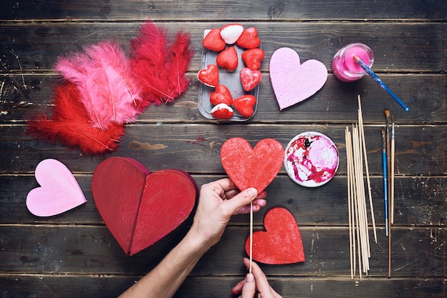 handcrafting on a wooden floor background view from above