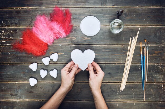 handcrafting on a wooden floor background view from above