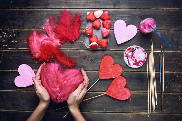 handcrafting on a wooden floor background view from above