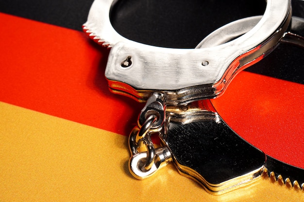 Handcuff on the flag of Germany.