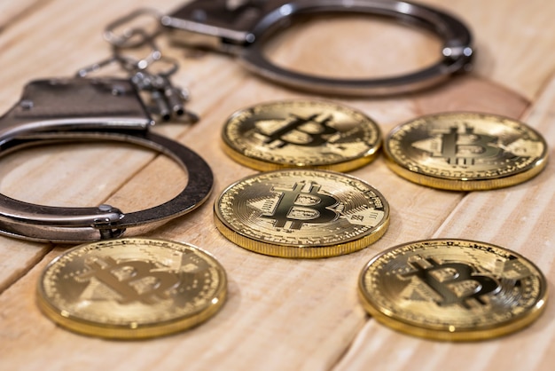 Handcuff and gold bitcoin. crime conception