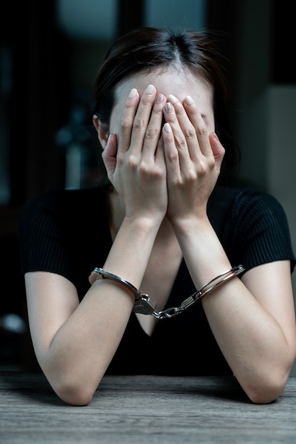 Handcuffed on a prisoner, Woman prisoners were handcuff in the dark prison.