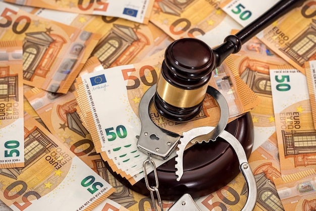 Handcuffs and euro banknotes