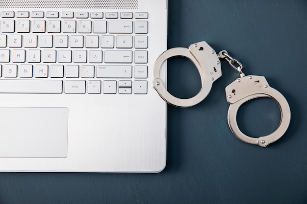 Photo handcuffs on the laptop