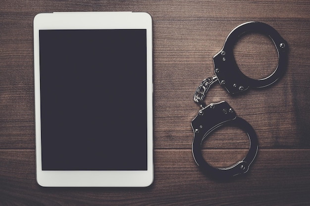 Handcuffs and tablet computer