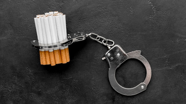 Photo handcuffs with cigarettes