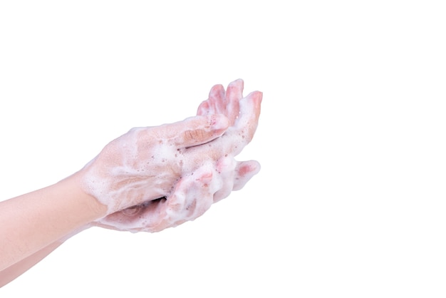 Handen wassen geïsoleerd op een witte achtergrond. Aziatische jonge vrouw die vloeibare zeep gebruikt om handen te wassen, concept van bescherming van pandemisch coronavirus, close-up.