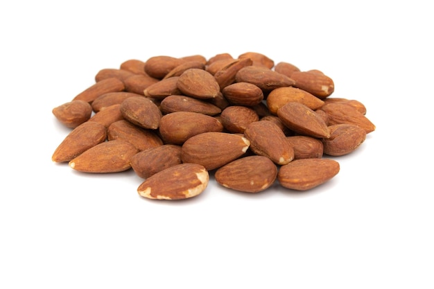 A handful of almonds isolated on white background The almond is the fruit of the almond tree