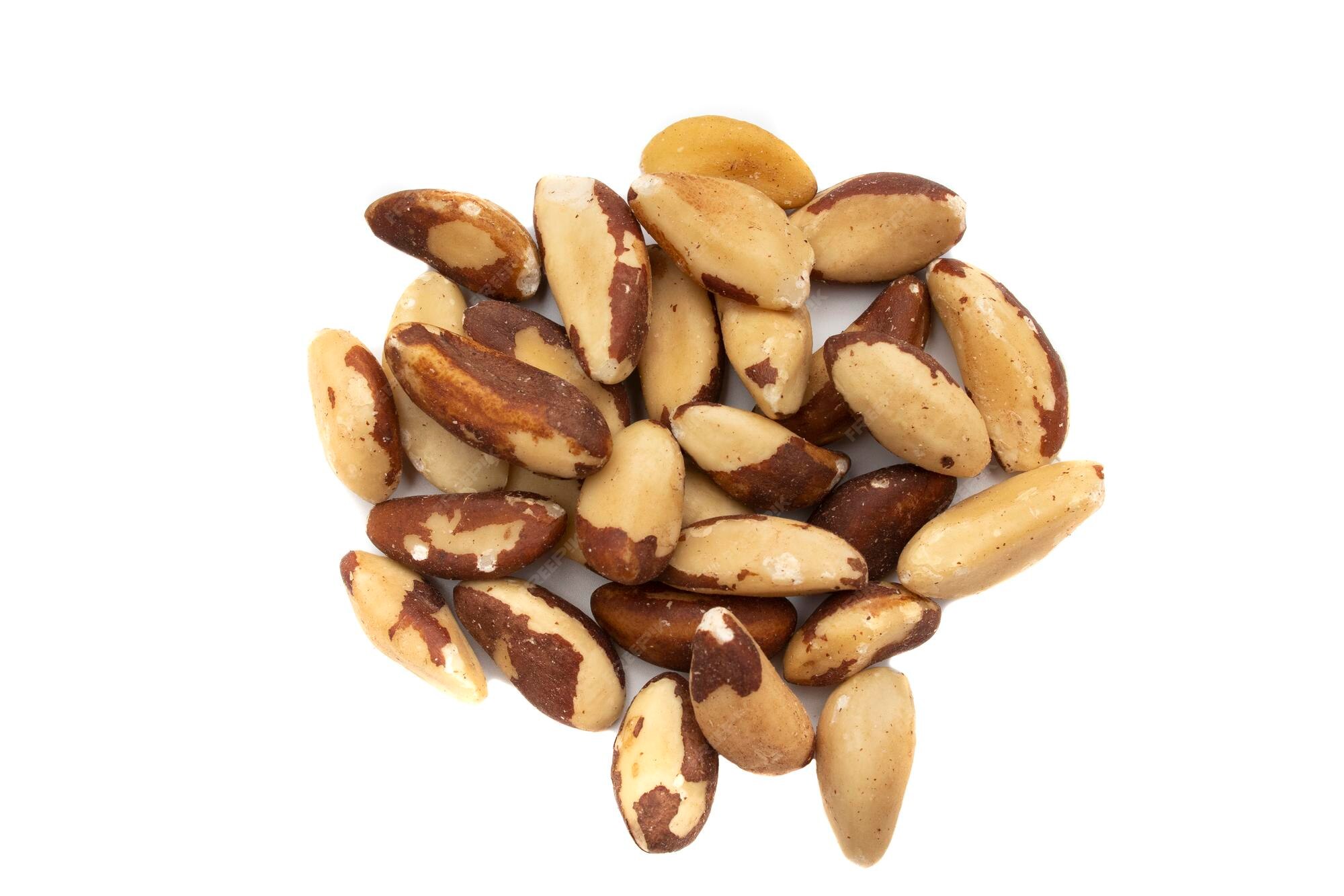 Premium Photo | A handful of brazil nuts or amazon nuts isolated on