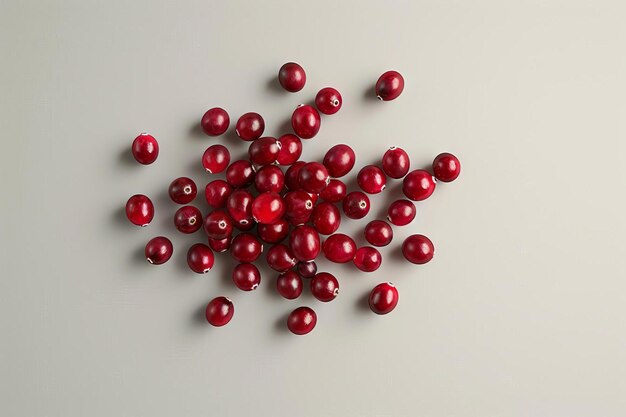 Photo a handful of cranberries scattered loosely highlighting their glossy red surface and small size