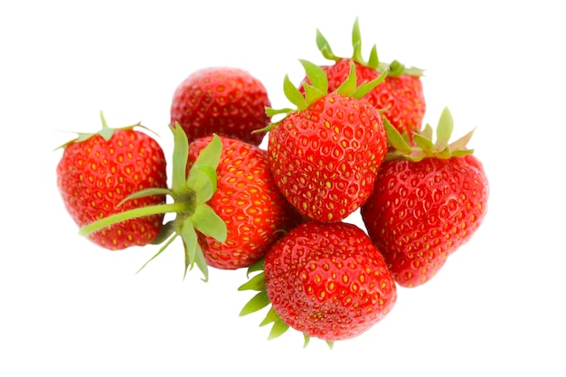 A handful of a few strawberries closeup isolated on white