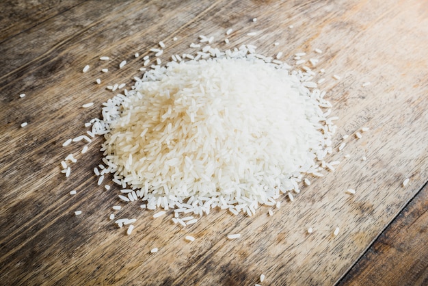 Handful of rice on a wooden table